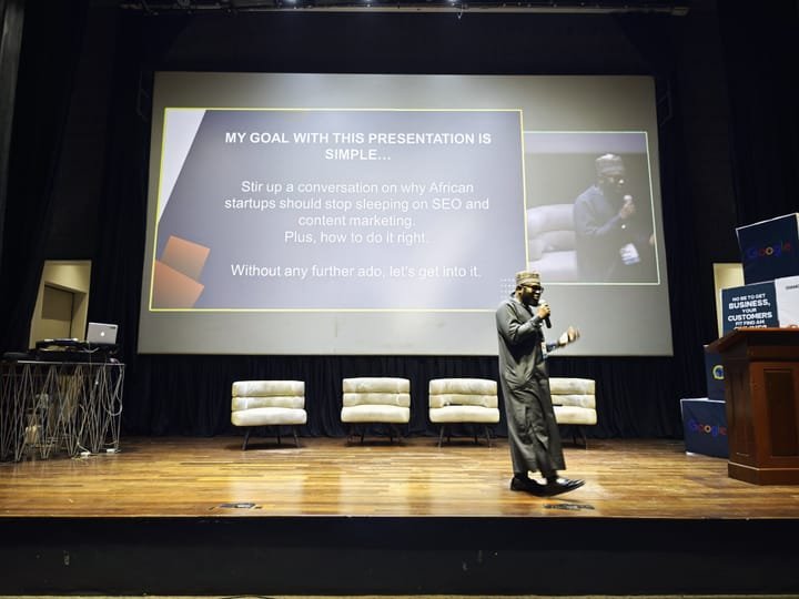 Shehu AbdulGaniy presenting on stage at Search Africon